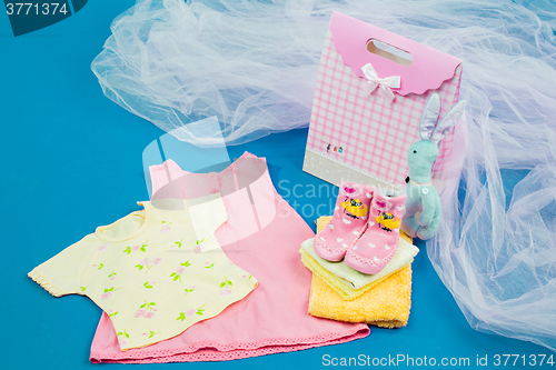 Image of The baby clothes with a  gift box