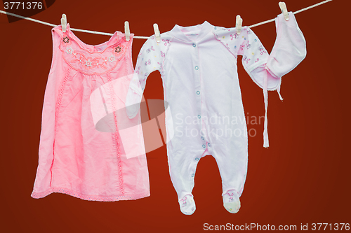 Image of Baby goods hanging on the clothesline