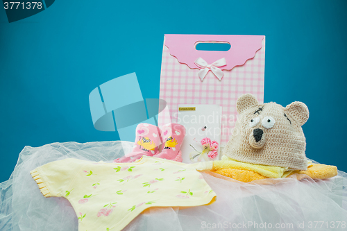 Image of The baby clothes with a  gift box