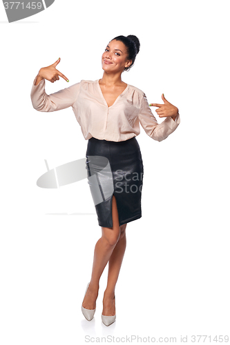 Image of Business woman in full length pointing at herself