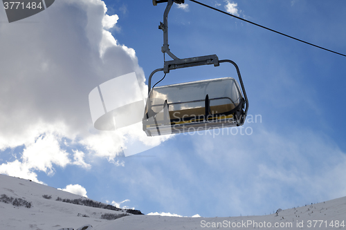 Image of Chair-lift in ski resort at sun evening