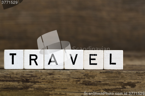 Image of The word travel written in cubes