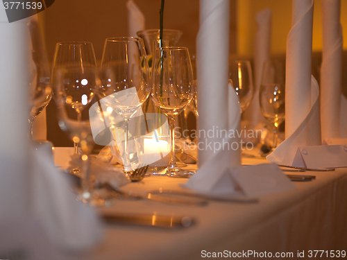 Image of Wine glasses at a laid table