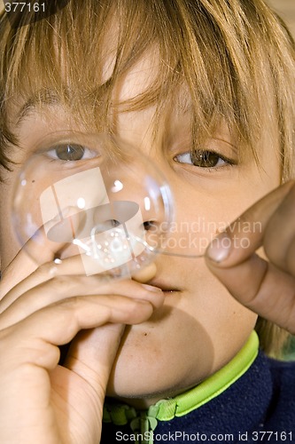 Image of boy blowing bubbles