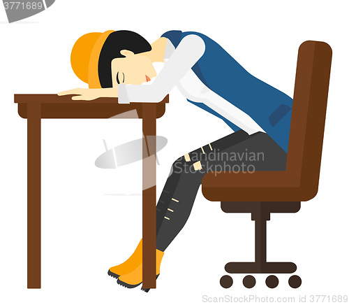 Image of Woman sleeping on table.