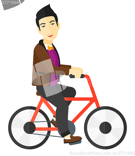 Image of Man riding bicycle.