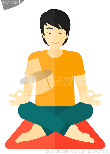 Image of Man meditating in lotus pose.