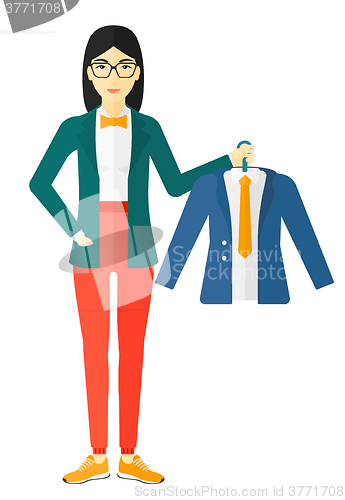 Image of Woman holding jacket.