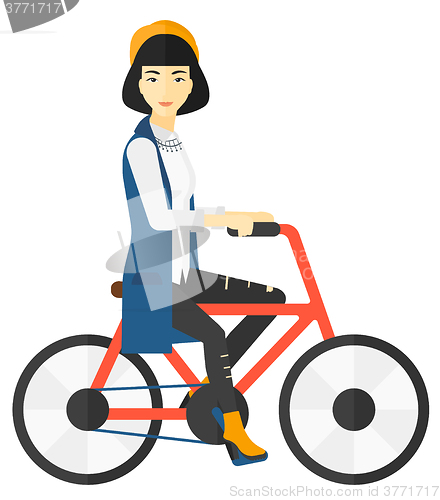 Image of Woman riding bicycle.