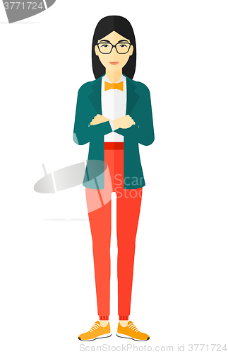 Image of Woman standing with crossed arms.