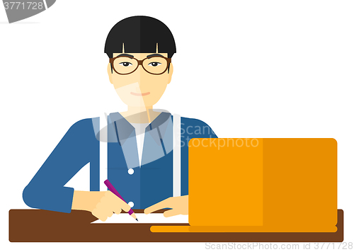 Image of Man using laptop for education.