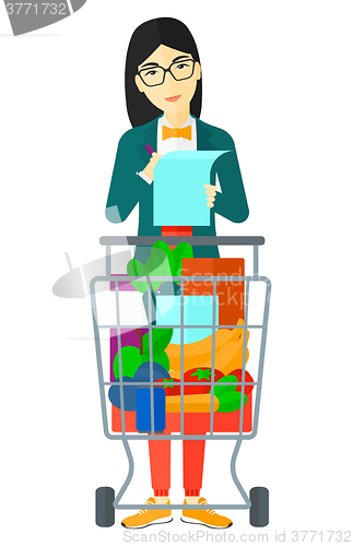 Image of Woman with shopping list. 