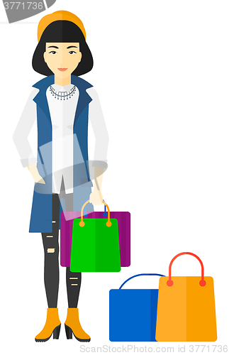 Image of Buyer with shopping bags.