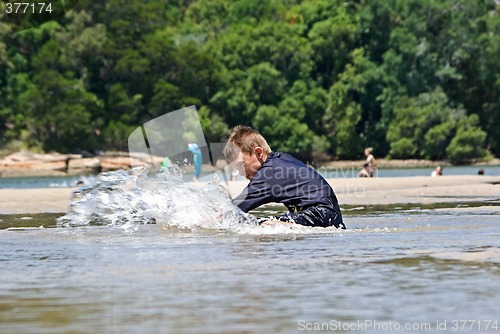 Image of boy splashing water