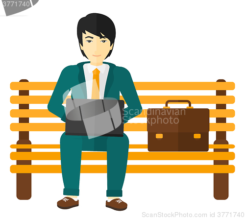 Image of Man working on laptop.