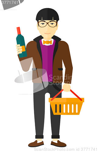 Image of Customer with shopping basket and bottle of wine.