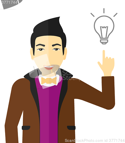 Image of Man pointing at light bulb.