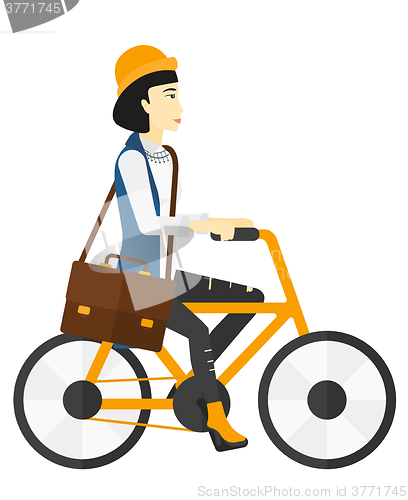 Image of Woman cycling to work.