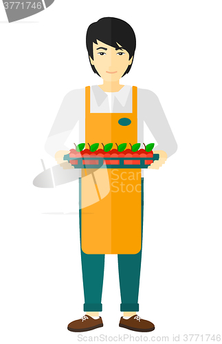 Image of Smiling supermarket worker.