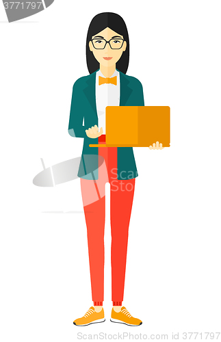 Image of Woman using laptop.