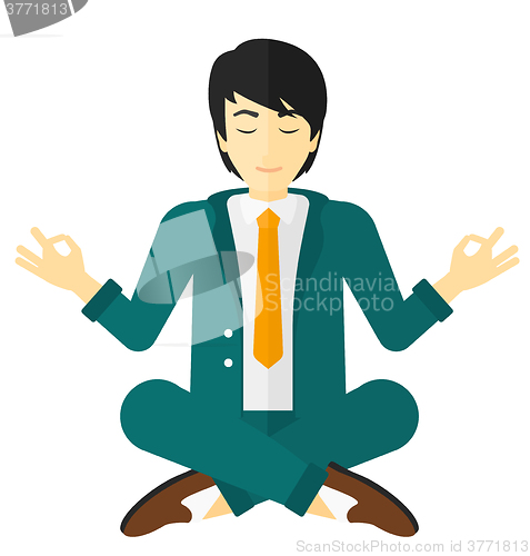 Image of Businessman meditating in lotus pose.