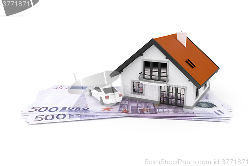Image of house and car above money
