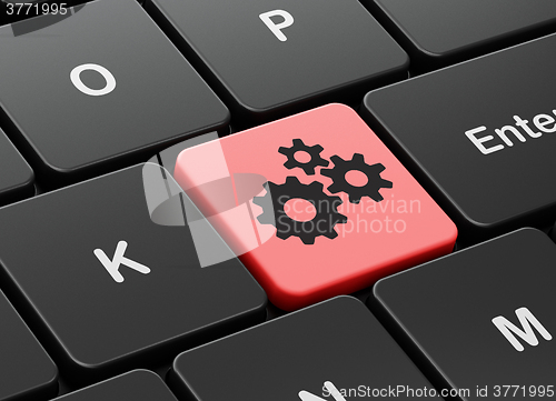 Image of Web design concept: Gears on computer keyboard background