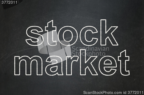 Image of Finance concept: Stock Market on chalkboard background