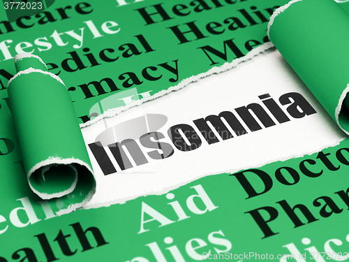 Image of Medicine concept: black text Insomnia under the piece of  torn paper