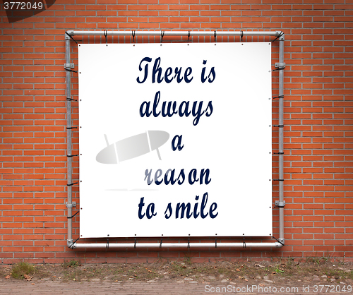 Image of Large banner with inspirational quote on a brick wall