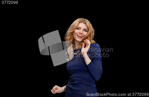 Image of happy young woman dancing at night club disco