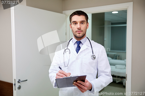 Image of doctor with stethoscope and clipboard at hospital