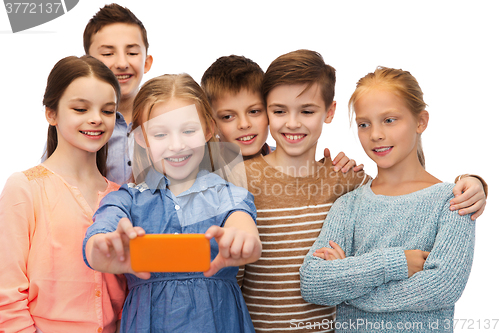 Image of happy children talking selfie by smartphone