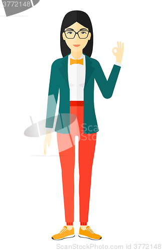 Image of Woman gesturing OK sign. 