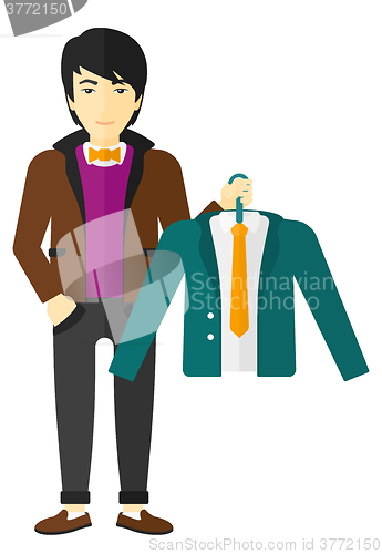 Image of Man holding jacket.