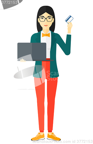 Image of Woman making purchases online.