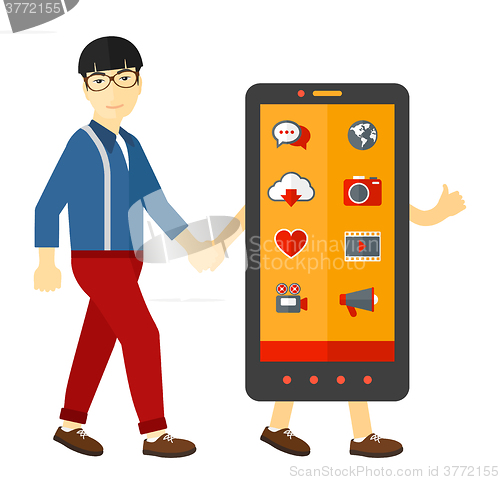 Image of Man walking with smartphone.