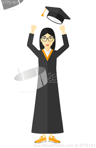 Image of Graduate throwing up her hat.