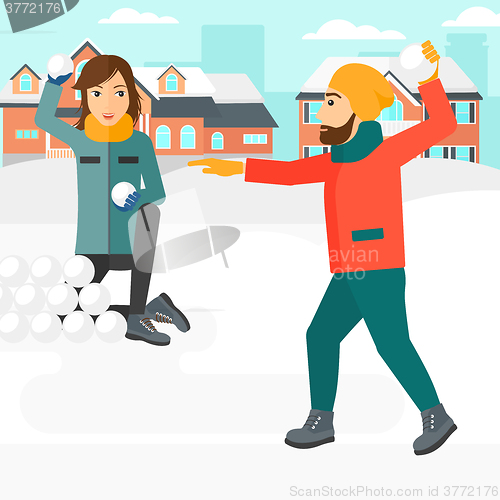 Image of Couple playing in snowballs.