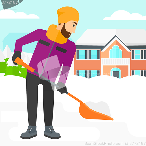 Image of Man shoveling and removing snow.