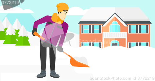 Image of Man shoveling and removing snow.