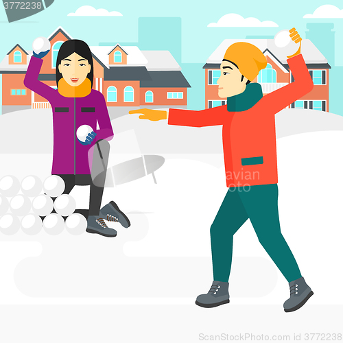 Image of Couple playing in snowballs.