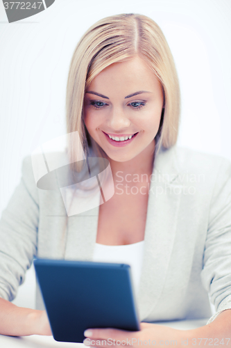 Image of smiling student girl with tablet pc