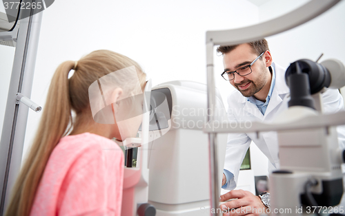 Image of optician with tonometer and patient at eye clinic