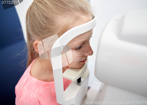 Image of optician with tonometer and patient at eye clinic