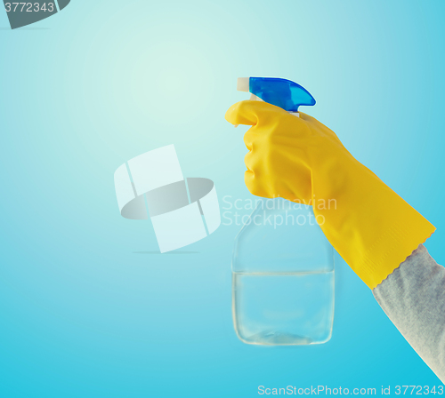 Image of close up of hand with cleanser spraying