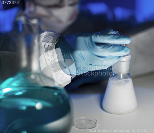 Image of close up of scientist making test in laboratory