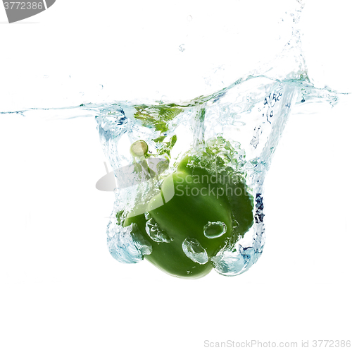 Image of pepper falling or dipping in water with splash