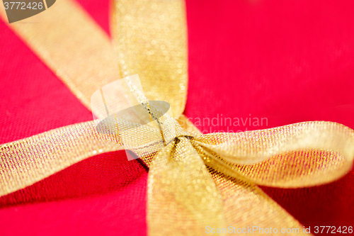 Image of close up of red gift box with bow
