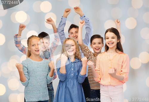 Image of happy children celebrating victory